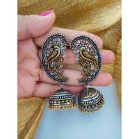 A stunning pair of jhumkis is always a must-have in Indian attire. Especially, white ethnics have long favored oxidized silver jewelry, and we're certain that these oxidized ghungroo jhumkis will be all you need to complete your look. Dreamy ghungroos by the edge of these oxidized earrings and delicate flower embellishments adorn this appealing set of Indian silver jewelry. It's a unique set of Indian earrings that tells a story about your outfit. Because all of our Indian jewelry is handmade, t