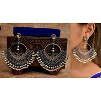 A statement maker in every sense ! Our Bestseller Satakshi Peacock earrings combines bold with delicate. These spectacular earrings include a pretty moon symbol with two love bird motifs and beautifully falling ball chains to add to the drama. Handcrafted in oxidized brass these earrings are one of a kind. The lightweight hanging ball chains brush against your shoulders adding a certain playfulness to your character. Can be paired with your favorite Indo-western outfit.