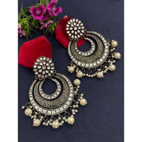 Step out in style with this beautiful oxidised silver plated earrings, which have been given a drop designer dangler perfectly designed. It will add bling to your look. This earring will go well with any of your ethnic outfits.