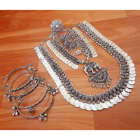 Make every head turn in your direction when you walk in wearing a cascade of pearls around your neck with a Charu Pearl Layered Oxidized Jewelry Set. If you want to go for royal Indian jewelry, then pearls are the best choice for you. They can be worn for parties, formal gatherings, festivals, or as wedding jewelry. Strings of pearl across your neck can set the perfect Indo-western look that you are aiming for. Go for this style statement from Vastrabhushan and get assured gifts on every purchas
