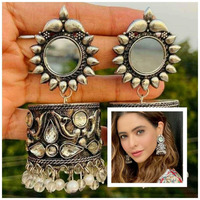 Make an ultimate statement with this striking bangle set. Ornate yet simple, these bangles adds a subtle drama to your wrist. Features an intricately crafted circular motif, accentuating your minimals, this can be paired to perfection with a glorious oxidized necklace or a pair of earrings to complete the look. Goes well with your everyday kurtas and saree looks.