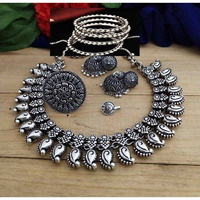 This beautiful oxidized Haath Phool is a part of Indian bridal jewelry. This Indian ethnic Haath Phool comes with an attached adjustable RingIt is easy to see why oxidized jewelry has gained popularity. Not only does it have a unique look but it is versatile and cost effective in comparison to purer metals like gold and silver. Oxidized metal comes in myriad patterns with stone work, delicate carving and enamelling to name a few. These pieces have an old world charm and traditional appealAmazing