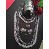 Add charm and Charisma to your beautiful personality with this exquisitely designed and handcrafted German Silver and oxidised necklace and earrings combo set pair it with any casual semi formal or informal attire and gather compliments for unique and classy choice ideal wear for both casual and dressy occasions