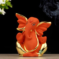 INDICAST Resin God Ganpati Gold Plated Ganesha Idol for Car Dashoboard & Home and Office Dcor - (4x3x8cm, Orange)