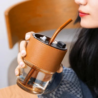 Kikiluxxa Glass Sipper Tumbler Lid And Straw Coffee Tumbler Tea Coffee Mugs With Leather Sleeve Cup And Mug For Kids Milk Juice Mug For Water Drinking Sipper (Brown),435 Ml