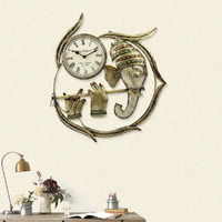 Handicrafts Paradise Wrought Iron Brown Ganesha Playing Flute Decorative Handmade Wall Clock Showpiece, 19 Inch