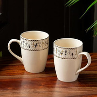 Exclusivelane 'Whispers Of Warli' Handcrafted Ceramic Coffee Mug Set Of 2 (Microwave Safe, 300 Ml) | Tea Mugs For Coffee