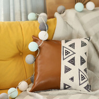 Triangular Motifs And Brown Faux Leather Throw Pillow