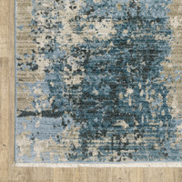 5 X 8 Blue grey Ivory Light Blue And Dark Blue Abstract Power Loom Stain Resistant Area Rug With Fringe