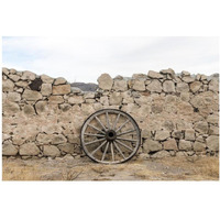 Wagon wheel against a stone fence at Hueco Tanks State Park, northwest of El Paso, TX-Paper Art-20"x14"