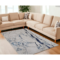 7' X 10' Ivory and Blue Marble Power Loom Distressed Area Rug