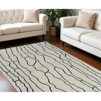 8' X 11' Cream and Black Abstract Distressed Area Rug