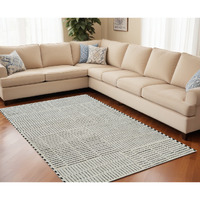 5' X 8' Cream and Black Abstract Distressed Area Rug