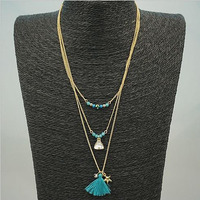 TASSEL AND TRINKETS Layered Necklace