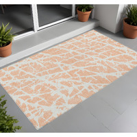 2' X 3' Peach and Ivory Abstract Washable Non Skid Indoor Outdoor Area Rug