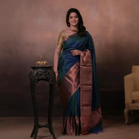 Bhadra - Teal Blue Plain Handwoven Silk Saree With Copper Zari Border