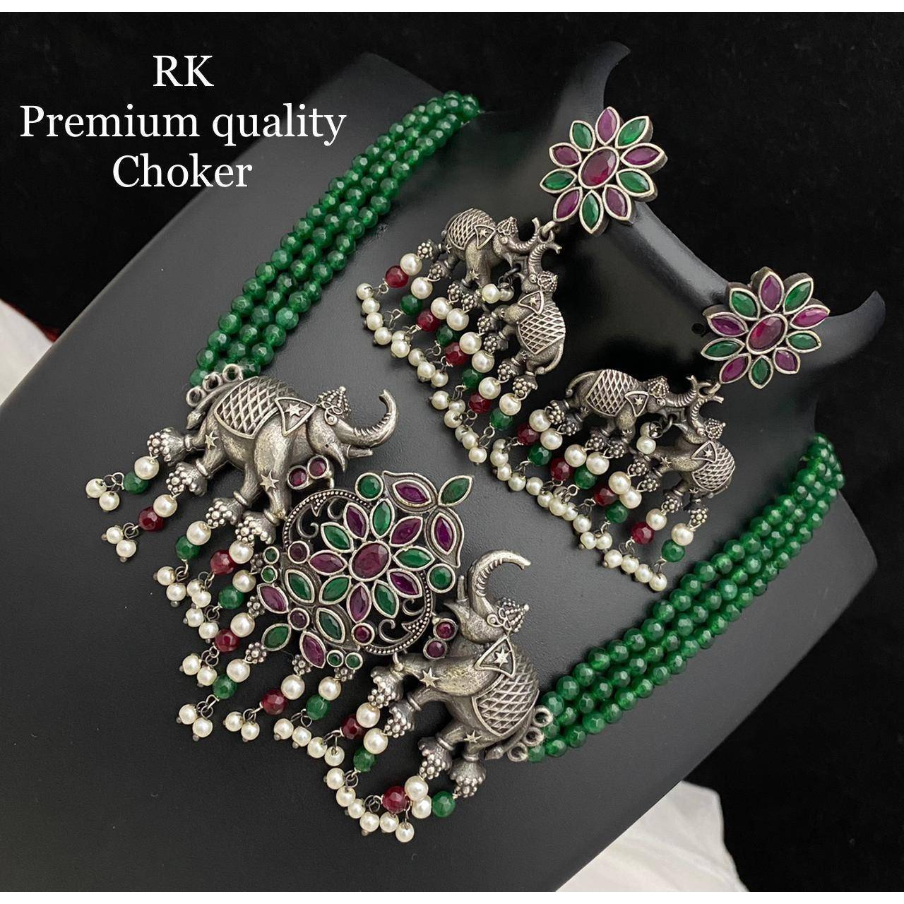 This minimalistic long oxidized necklace set is perfect for an Indian bride. Beautifully designed with German oxidized silver, this wedding set has a big intricate Haram oxidized necklace, a pair of stud earrings, a ring, a pair of bangles, and a nose pin.Each of these pieces will work wonderfully on its own and even more elegant when worn together. You can also style them with your Navratri outfit or any ethnic outfit to make those eyes stare at you This product has been handcrafted and may ha
