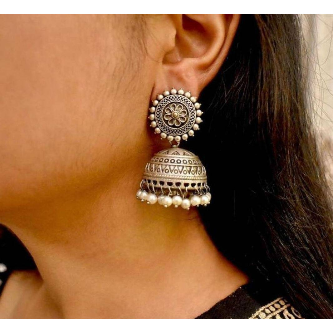 An interesting mix of dual tone finishing translates into this spectacular oxidised set that spell classy and stylish at the same time. Handcrafted in brass, with gold and silver oxidized plating, this classic set of 5 containing a long haram, a pair of earrings, ring, nose pin and a set of bangles, captures the unwind regal romance and can be paired with your Indian or indo western attires to look stellar.