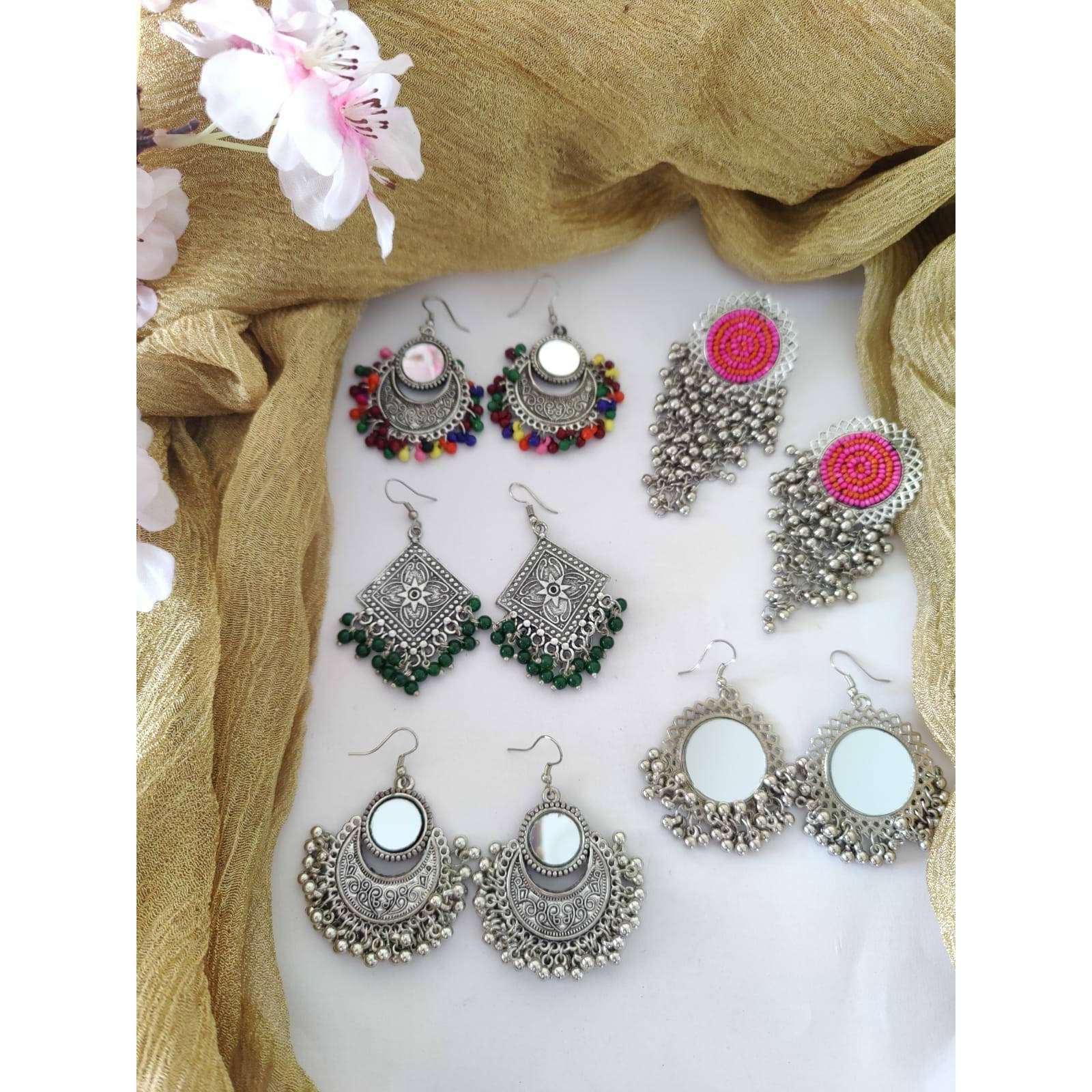 Celebrate your Navratri with this double necklace ful combo set.This beautiful set of 5 has a big long Haram oxidized necklace, pair of jhumka earrings, a ring,pair of bangles, and a nose pin.Grab this beautiful set with any of the ethnic/ Indo western outfit and look unique in the crowd.Premium quality