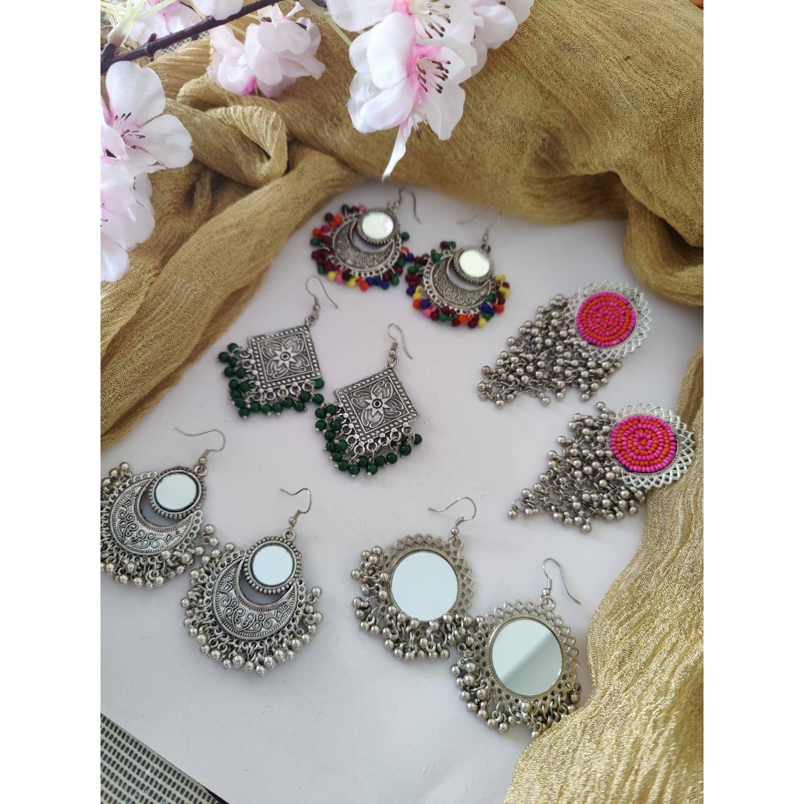 Celebrate your Navratri with this double necklace ful combo set.This beautiful set of 5 has a big long Haram oxidized necklace, pair of jhumka earrings, a ring,pair of bangles, and a nose pin.Grab this beautiful set with any of the ethnic/ Indo western outfit and look unique in the crowd.Premium quality