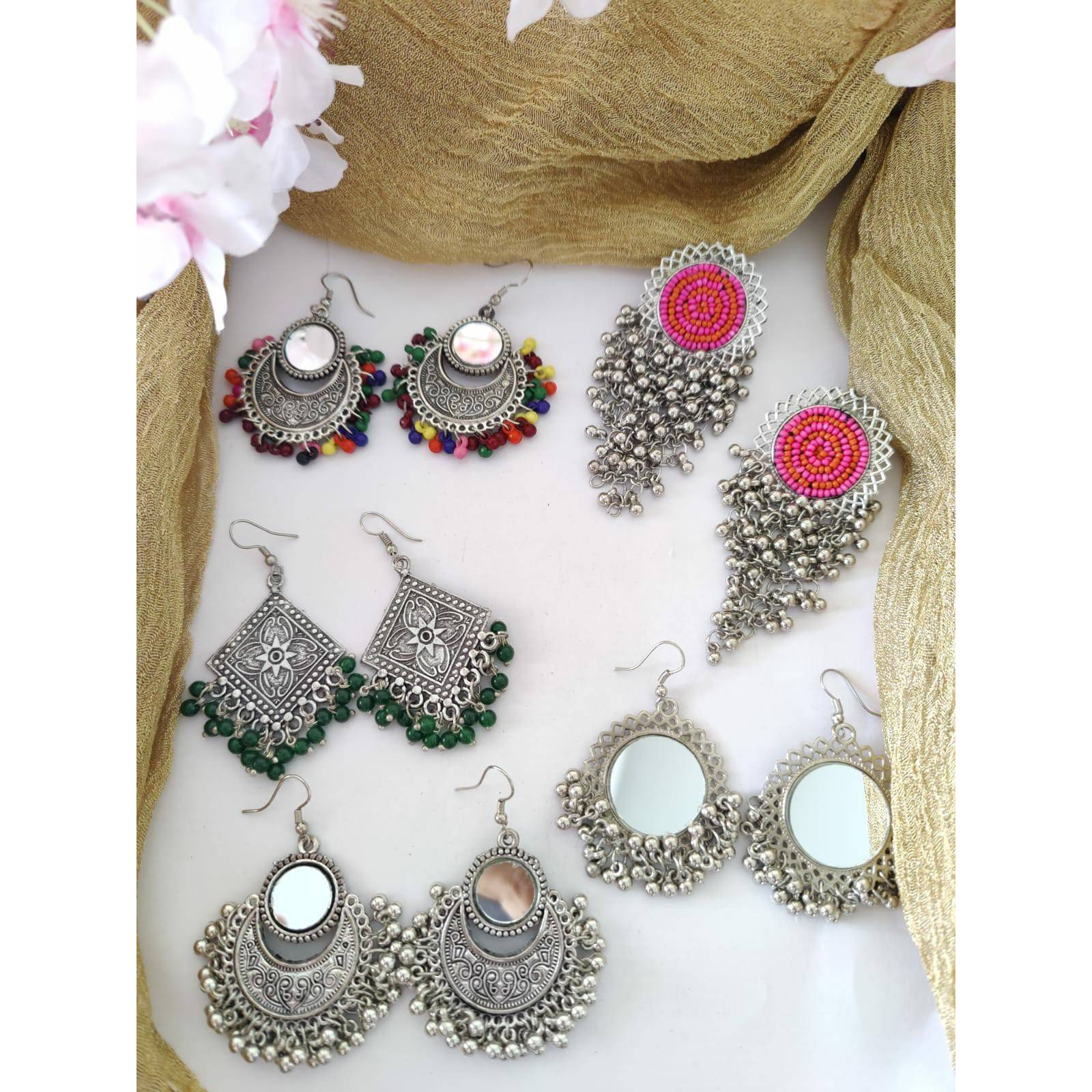 Celebrate your Navratri with this double necklace ful combo set.This beautiful set of 5 has a big long Haram oxidized necklace, pair of jhumka earrings, a ring,pair of bangles, and a nose pin.Grab this beautiful set with any of the ethnic/ Indo western outfit and look unique in the crowd.Premium quality