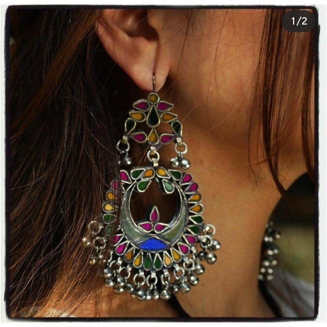 Outstanding German Silver long pendant necklace & drop earrings set. Carved floral design with crescent moon embellishments looks gorgeous. Contemporary look which will fit with your whole wardrobe It falls beautifully on the neckline giving you an elegant look. We trust our products and will never sell anything that we won't use ourselvesThis set includes choker necklace, stud earrings, ring and nose pin
