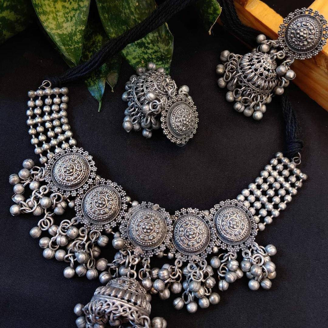 This set of 7 includes Ghungroo necklace, bangles, nosepin, dangler earrings, ring, anklets,  toe ringCelebrate every occasion with timeless pieces. Bringing you a unique box of Accessories that will brighten up your days in an instant Our Ghungroo Silver Oxidised Jewelry Set features a minimalist look. Each of these pieces is versatile and complements each other. Wear them together or separately, these are bound to shine Our Timely Treasures are the perfect gifts to give your loved ones or pa