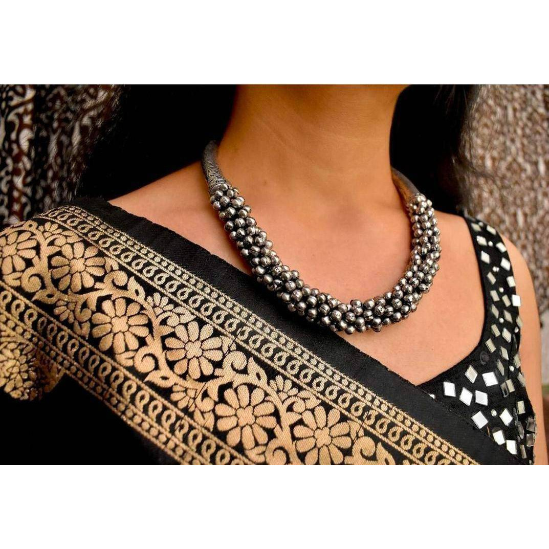 The dual-tone bead necklace amplifies the elegance and beauty of Indian women. Choose thisexcellent piece of handmade Indian jewelry to make heads turn. Its adjustable length makes it easyto wear and can be paired with sarees or ethnic dresses. Made with premium quality material, youcan rest assured of its quality. You can also select this piece as Navratri jewelry and combine fashionand elegance at the same time. Surprise a loved one with this wonderful Indian jewellery or getready to grab comp