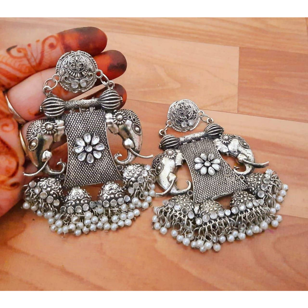 This is a beautiful pair of zircon stud earrings. The pack comes with one pair of beautiful studded oxidized earrings. You can choose from any of the two options provided. This pair will work with any Indian or western outfit. Buy this for yourself or get it as a gift for your loved ones. Besides, you will also get an assured gift on every purchase.The look is stunning and preciously suitable for all kinds of dressy occasions.COLOR  Same as PictureFor - Girls & WomenOCCASION PARTY WEAR , WEDDI