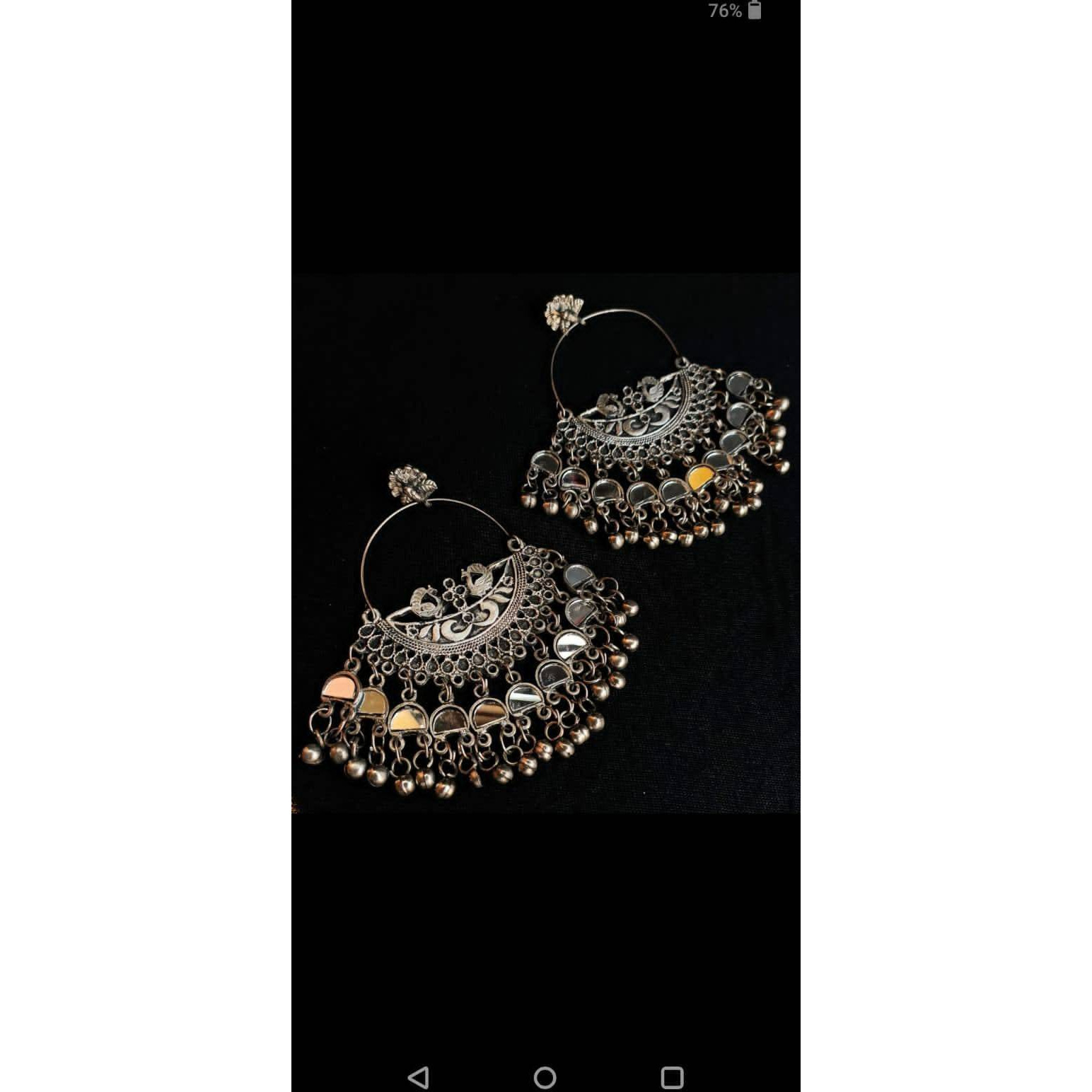 This oxidized choker set brings out the true beauty ofIndian jewelry. This is a versatile andbold, oxidized necklacethat will never go out of style and remain a timeless collection toyour set of jewelry. You can easily pair this statement piece of jewelry with a formal whiteshirt or ethnic traditional wear to make all heads turn towards you. Inspired by the dancingpeacocks, this unique peacock-laden choker is pureGerman silver jewelrysetfromVastrabhushanthat will bring ou