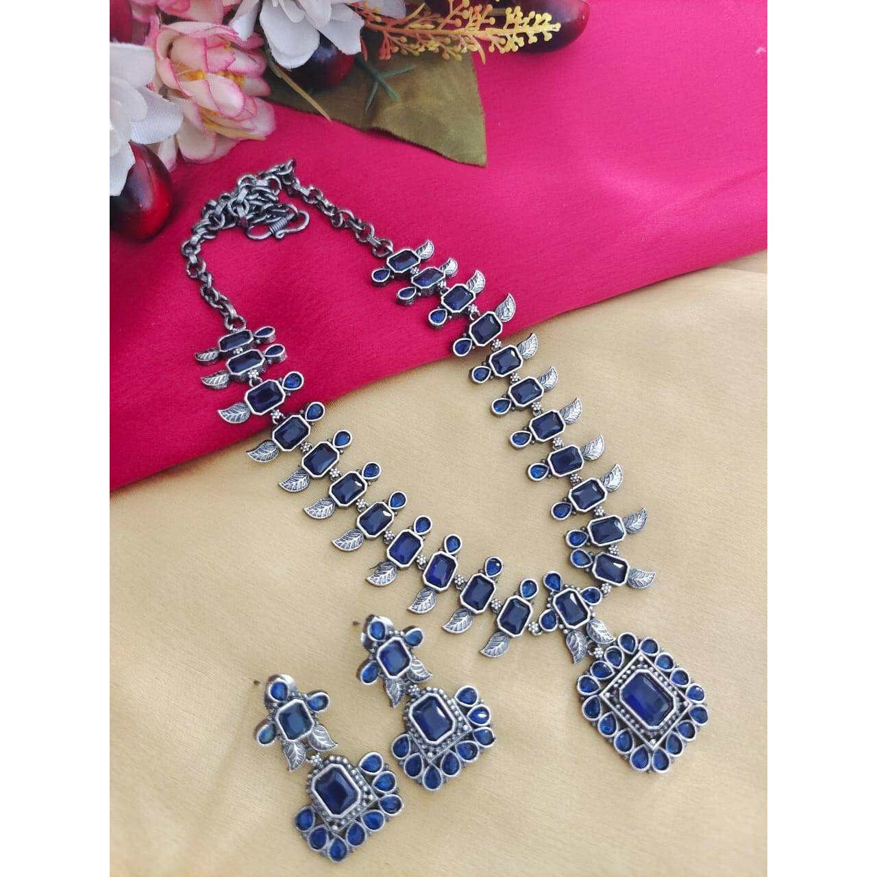 Step out in style with this beautiful oxidised silver plated dangler earrings, which have been given a drop designer dangler perfectly designed. It will add bling to your look. Simple yet standout design made for the Modern Indian woman who likes to add a bit of tradition to her everyday looks. The beautifully placed stones enhance the design story of the piece and add to its versatility. Style this delightful pair to work and take it beyond as it pairs well with almost any attire.Metal Brass W
