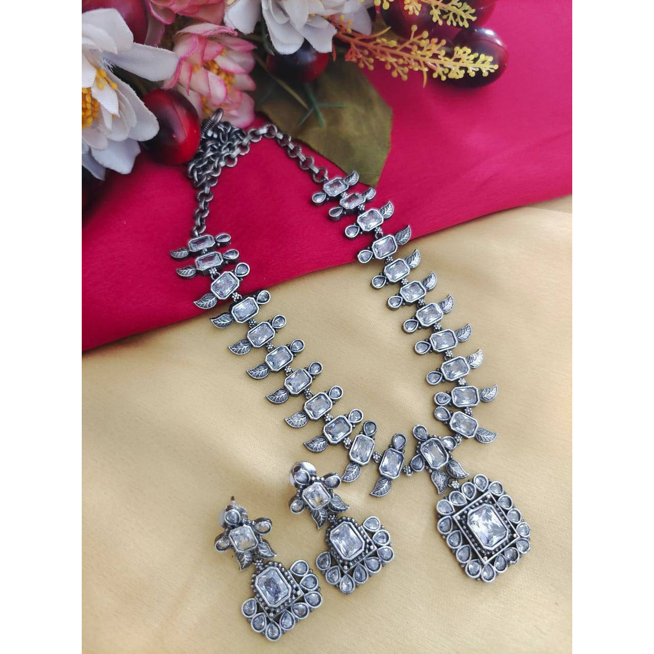 Step out in style with this beautiful oxidised silver plated dangler earrings, which have been given a drop designer dangler perfectly designed. It will add bling to your look. Simple yet standout design made for the Modern Indian woman who likes to add a bit of tradition to her everyday looks. The beautifully placed stones enhance the design story of the piece and add to its versatility. Style this delightful pair to work and take it beyond as it pairs well with almost any attire.Metal Brass W
