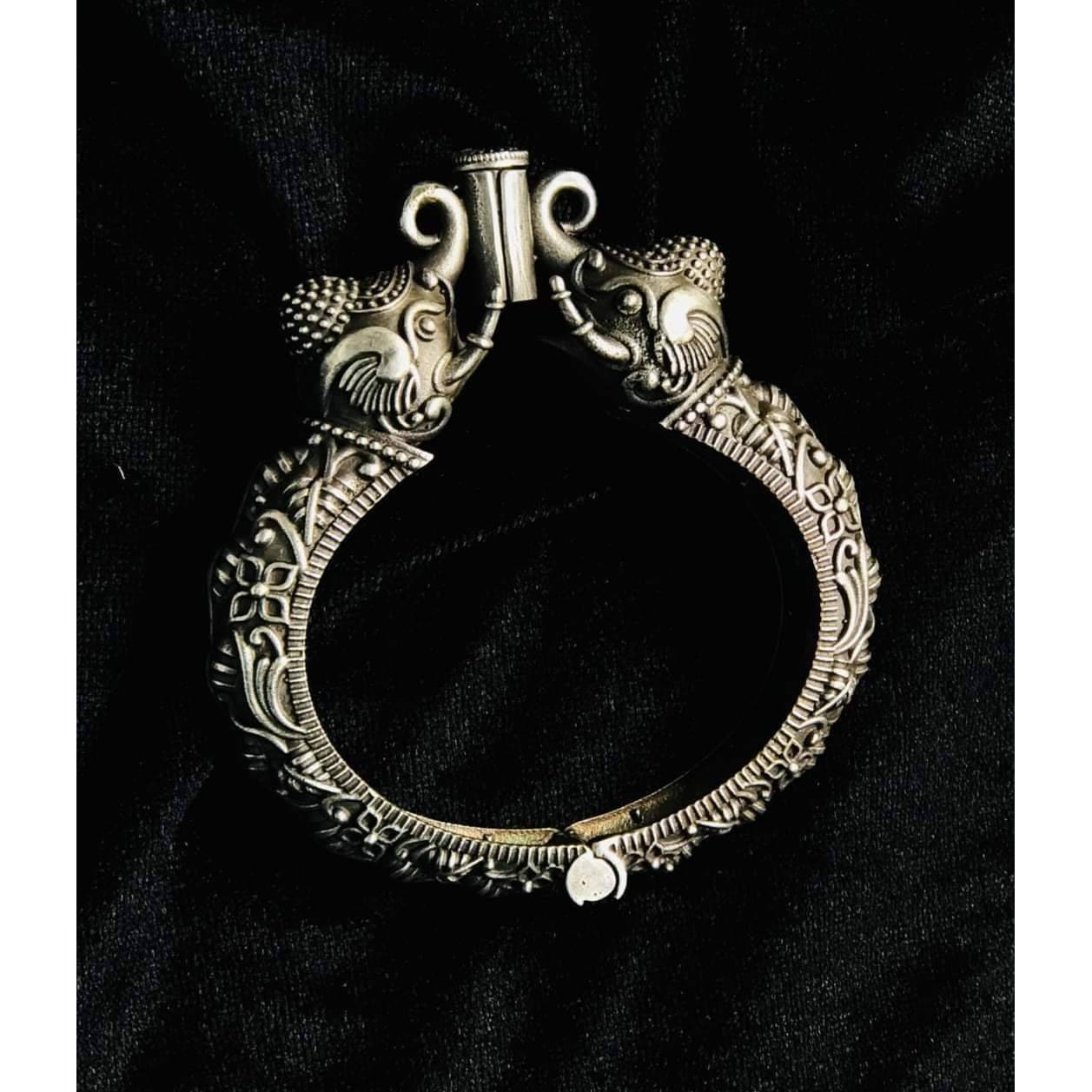 What's a traditional Indian dressing without a pair of lovely jhumki. Taking this iconic style ahead, our Floral Ethnic Silver Oxidised Jhumki Earrings will be your favorite to dress up your ethnics with. It features intricate detailing with tiny ghungroos that adds a touch of drama to your look