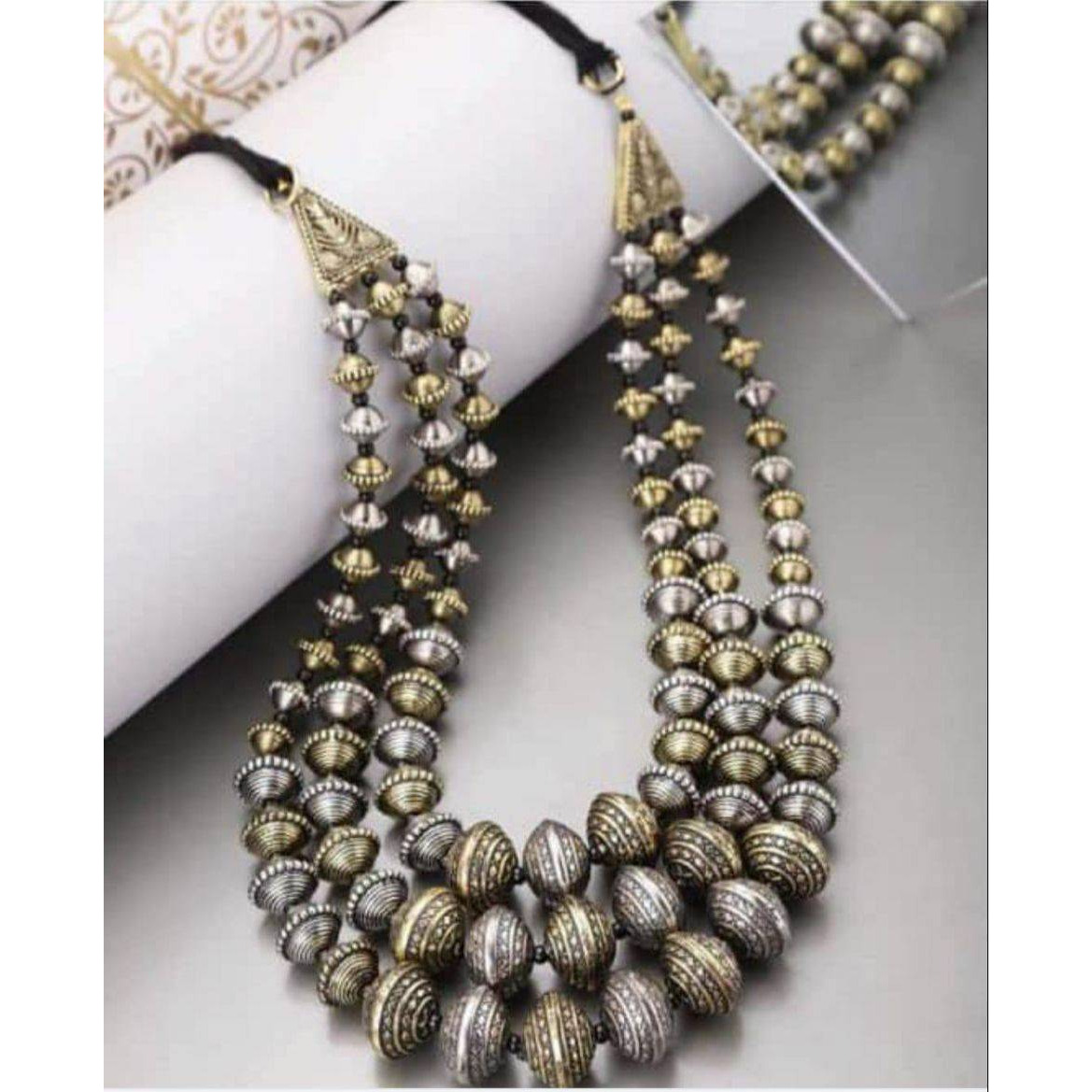 This beautiful oxidized Haath Phool is a part of Indian bridal jewelry. This Indian ethnic Haath Phool comes with an attached adjustable RingIt is easy to see why oxidized jewelry has gained popularity. Not only does it have a unique look but it is versatile and cost effective in comparison to purer metals like gold and silver. Oxidized metal comes in myriad patterns with stone work, delicate carving and enamelling to name a few. These pieces have an old world charm and traditional appealAmazing