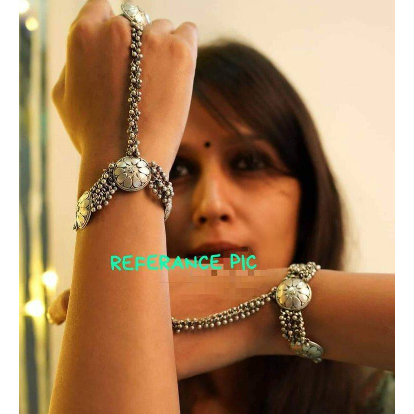A quirky bold ring that will draw attention immediately when it's on you It is a one-of-a-kind piece that will set you apart from the crowd. Crafted in german silver, this ring will add the right amount of drama to the look. This piece makes accessorizing effortless and complements most of your ethnic outfits.