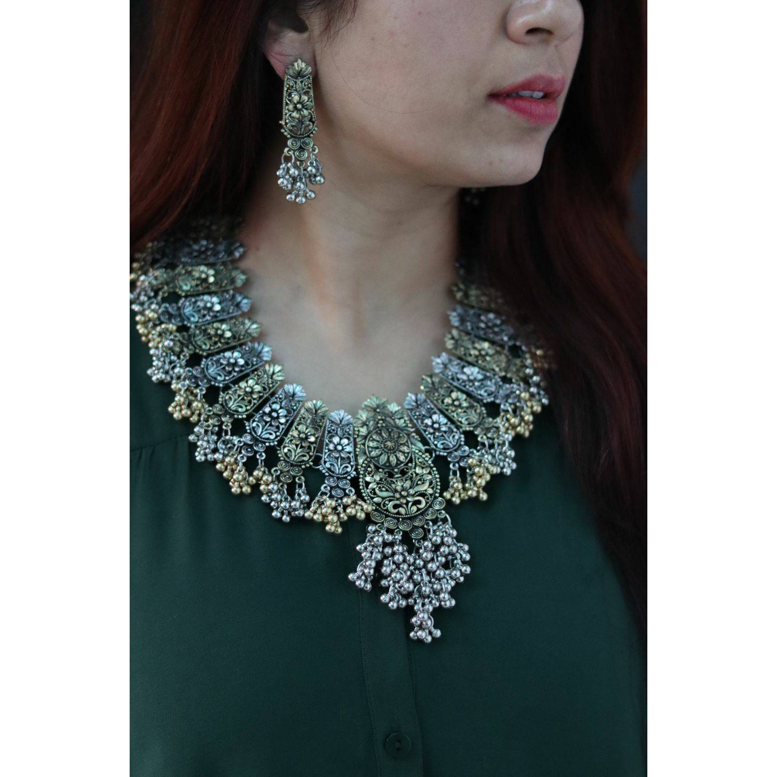 OverviewDual tone long chain pendant set with matching jhumkas , ring nosepin and bangles. These stylish Jewelry sets from VASTRABHUSHAN will certainly leave you spellbound. These Jewelry set have an excellent finish and gives out an exquisite sense of style. If you are looking for an amazing Fashion Jewelry set for special occasions such as Anniversary, Engagement, Party, Wedding or for gifting , then your search ends here.Add charm and Charisma to your beautiful personality with this exquisit