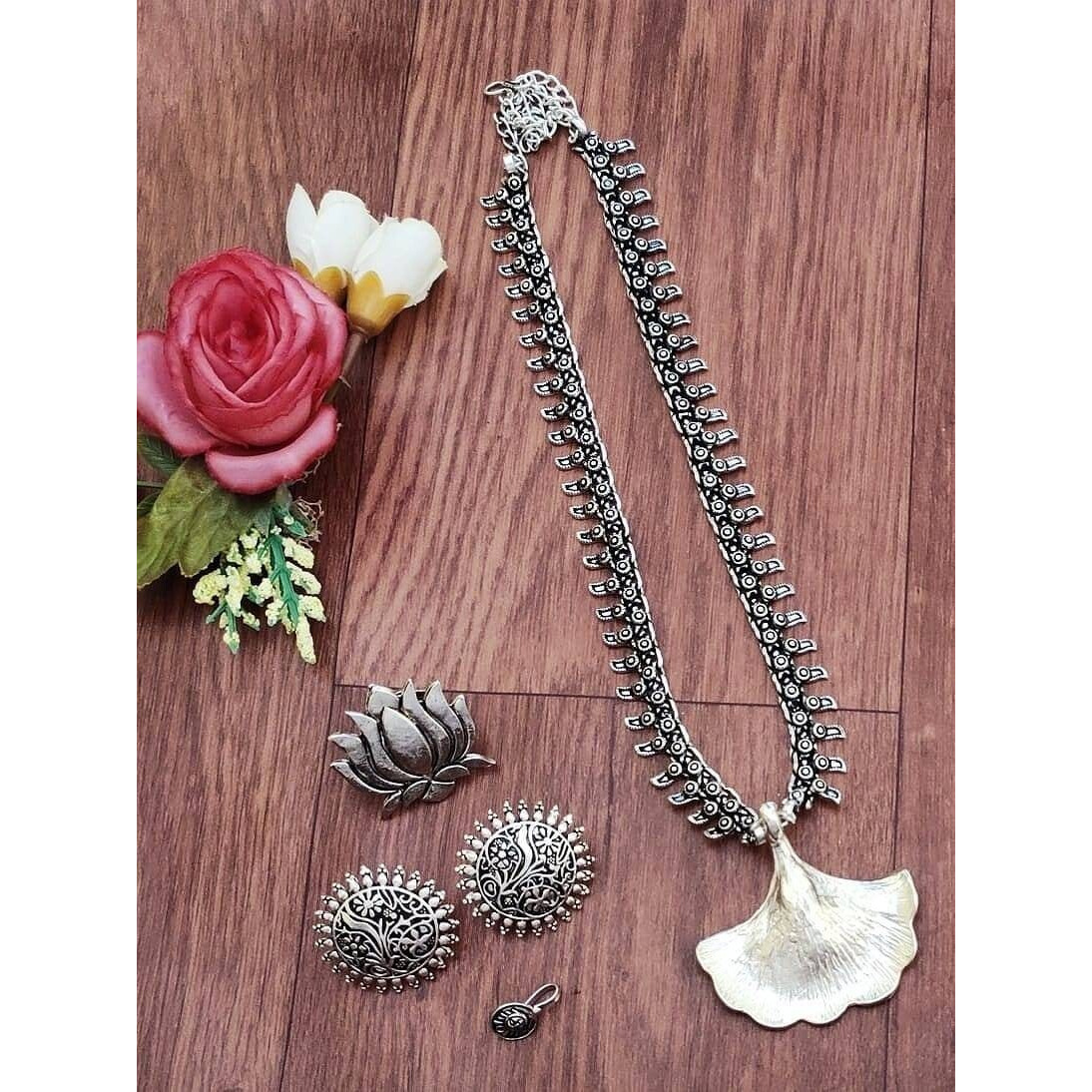This beautiful set of 6 has a big long Haram necklace with a choker silver necklace, pair of jhumka earrings, a ring,pair of bangles, and a nose pin.Grab this beautiful set with any of the ethnic/ Indo western outfit and look unique in the crowdPremium quality set