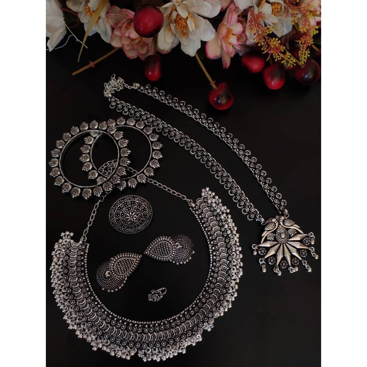 This beauty set of 6 includes long necklace, short necklace, ring, nose pin, bracelet and pair of earrings. Shop this unique antique looking set handcrafted with love by the experienced craftsmen just for you. you can pair the set with ethnic attire as well as casual to have a statement fusion look.Premium quality