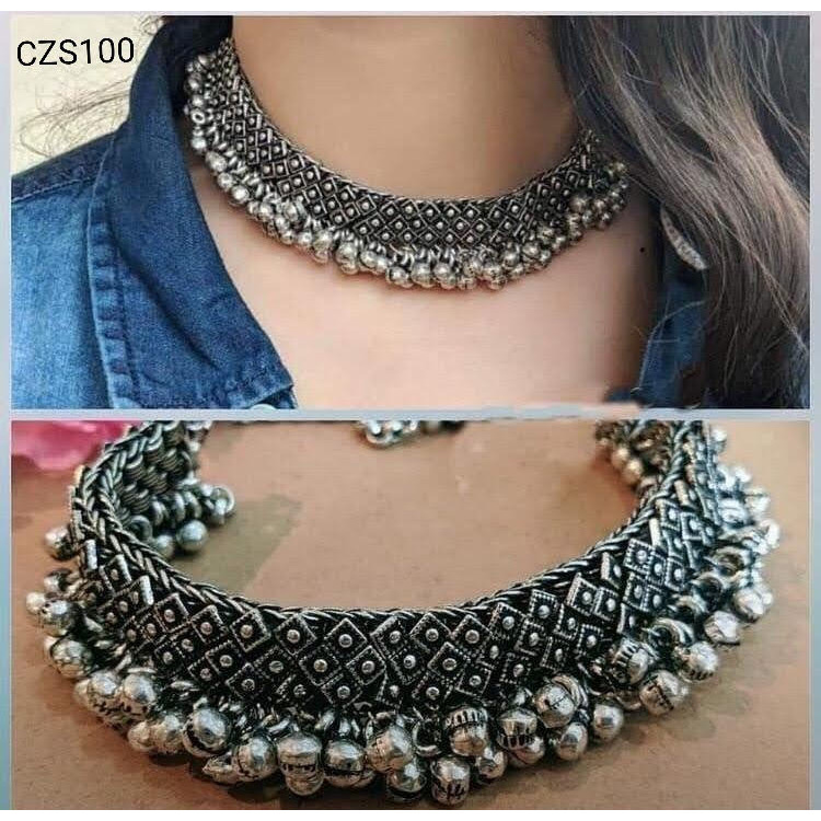 This set of 6 includes Ghungroo necklace, bangles, dangler earrings, toe ring, ring, nose pinCelebrate every occasion with timeless pieces. Bringing you a unique box of Accessories that will brighten up your days in an instant Our Ghungroo Silver Oxidised Jewelry Set features a minimalist look. Each of these pieces is versatile and complements each other. Wear them together or separately, these are bound to shine Our Timely Treasures are the perfect gifts to give your loved ones or pamper your