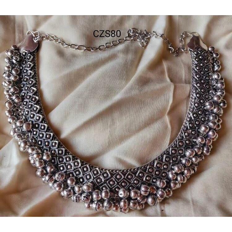 This set of 6 includes Ghungroo necklace, bangles, dangler earrings, toe ring, ring, nose pinCelebrate every occasion with timeless pieces. Bringing you a unique box of Accessories that will brighten up your days in an instant Our Ghungroo Silver Oxidised Jewelry Set features a minimalist look. Each of these pieces is versatile and complements each other. Wear them together or separately, these are bound to shine Our Timely Treasures are the perfect gifts to give your loved ones or pamper your