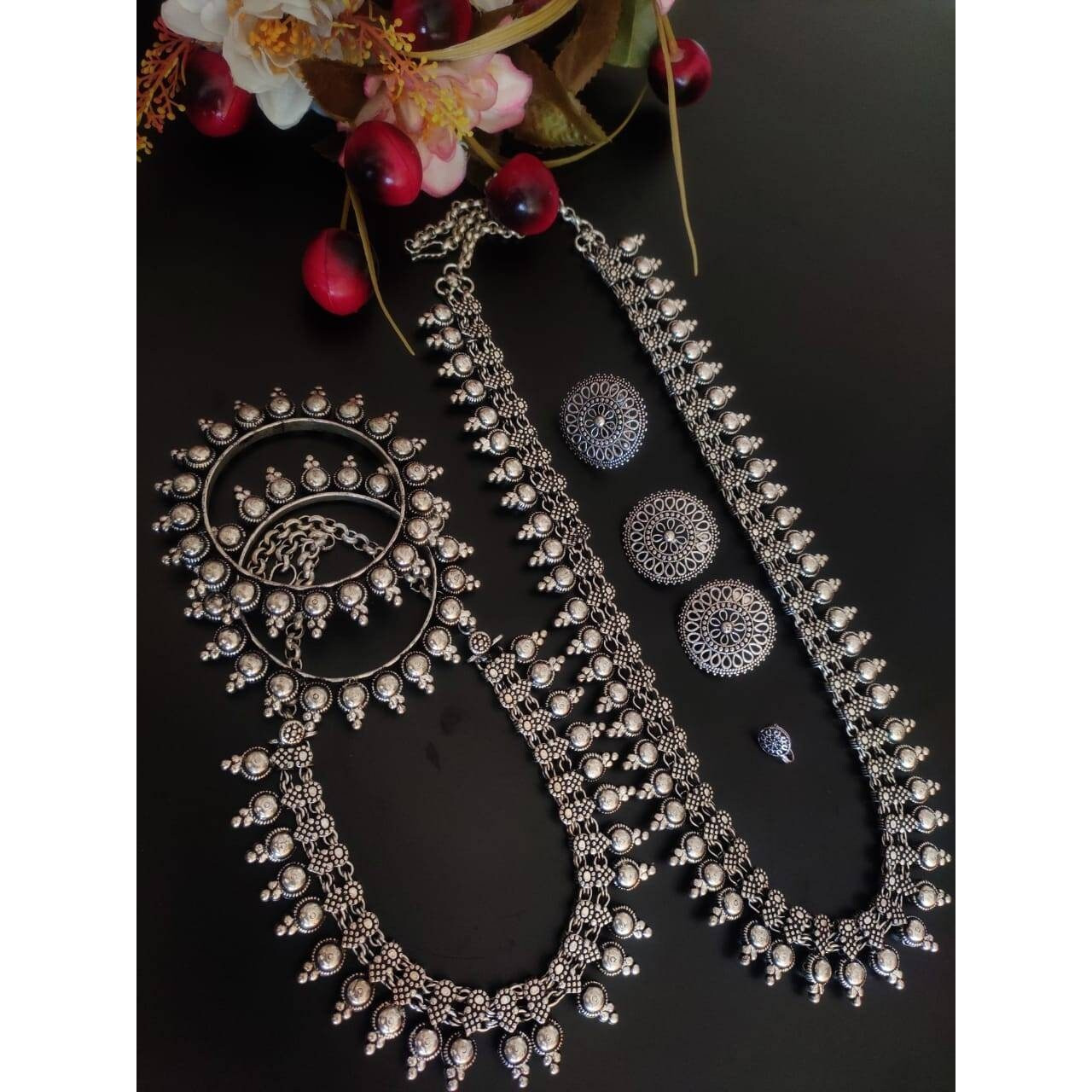 This is a beautiful pair of gypsy earrings. The pack comes with one pair of beautiful studded oxidized earrings. You can choose from any of the two options provided. You can either go for white and red stones or green and red stones. Both the options are great and will work with any Indian or western outfit. Buy this for yourself or get it as a gift for your loved ones. Besides, you will also get an assured gift on every purchase.Care Instruction When not in use keep these oxidized earrings awa