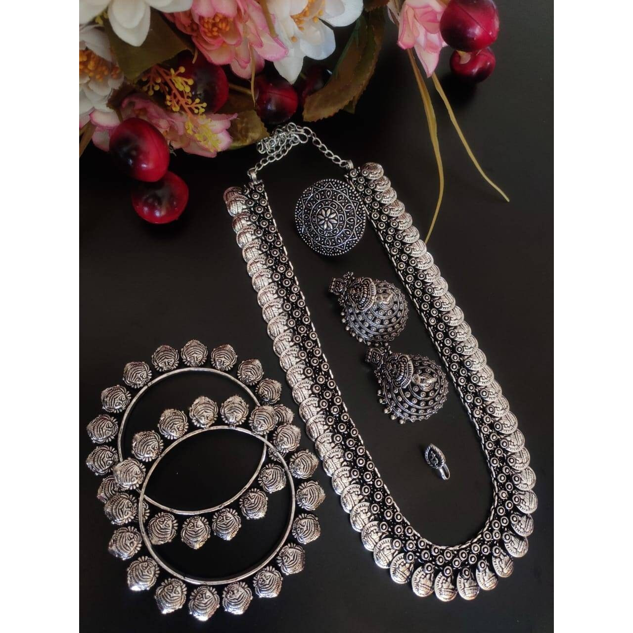 This is a beautiful pair of gypsy earrings. The pack comes with one pair of beautiful studded oxidized earrings. You can choose from any of the two options provided. You can either go for white and red stones or green and red stones. Both the options are great and will work with any Indian or western outfit. Buy this for yourself or get it as a gift for your loved ones. Besides, you will also get an assured gift on every purchase.Care Instruction When not in use keep these oxidized earrings awa
