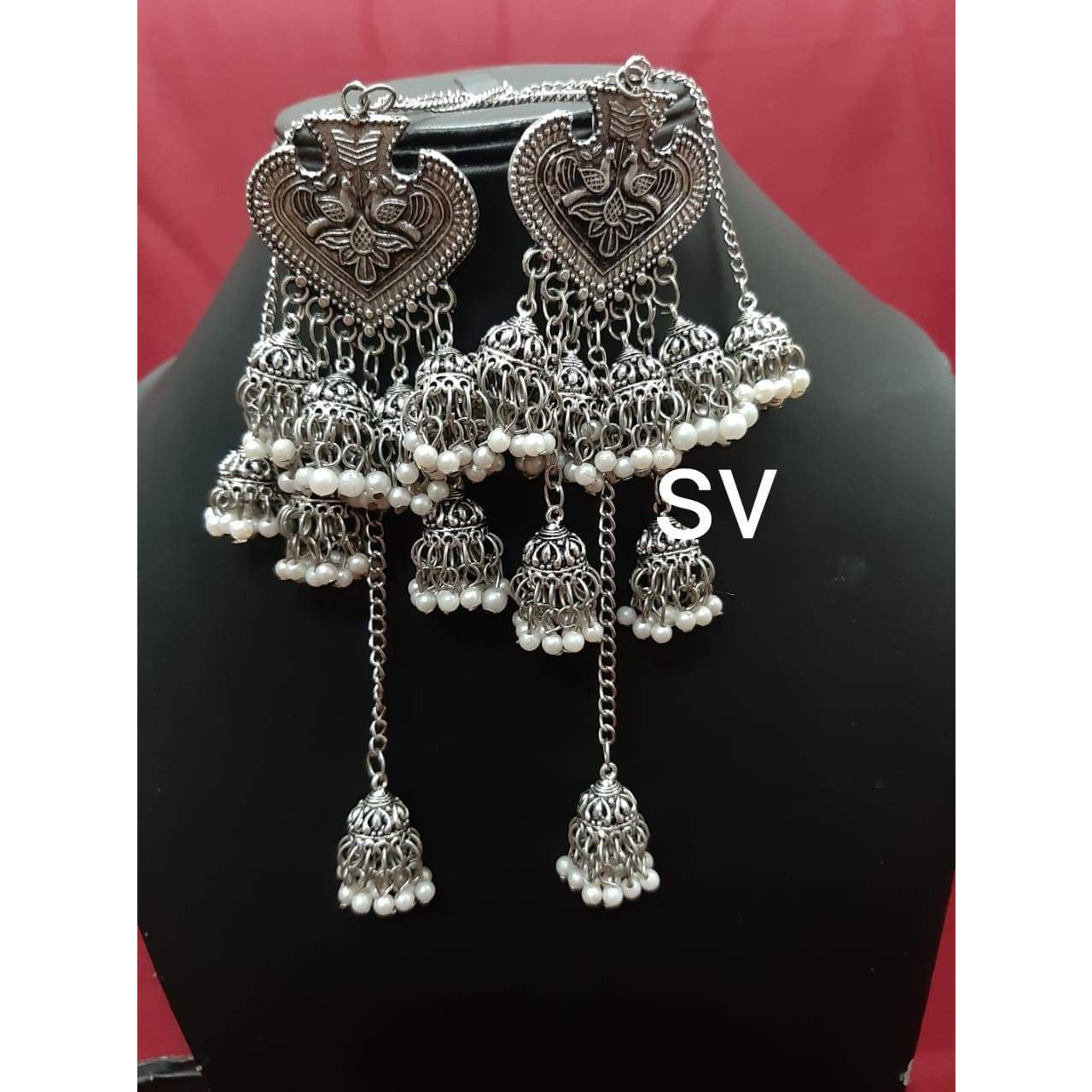 Add ethnicity and elegance to your beautiful personality with these exquisitely designed handmade earrings with pearls drop. The intricate designs gives these earrings a very classy touch. Wear them with any semi formal or casual attire and gather compliments all the way
