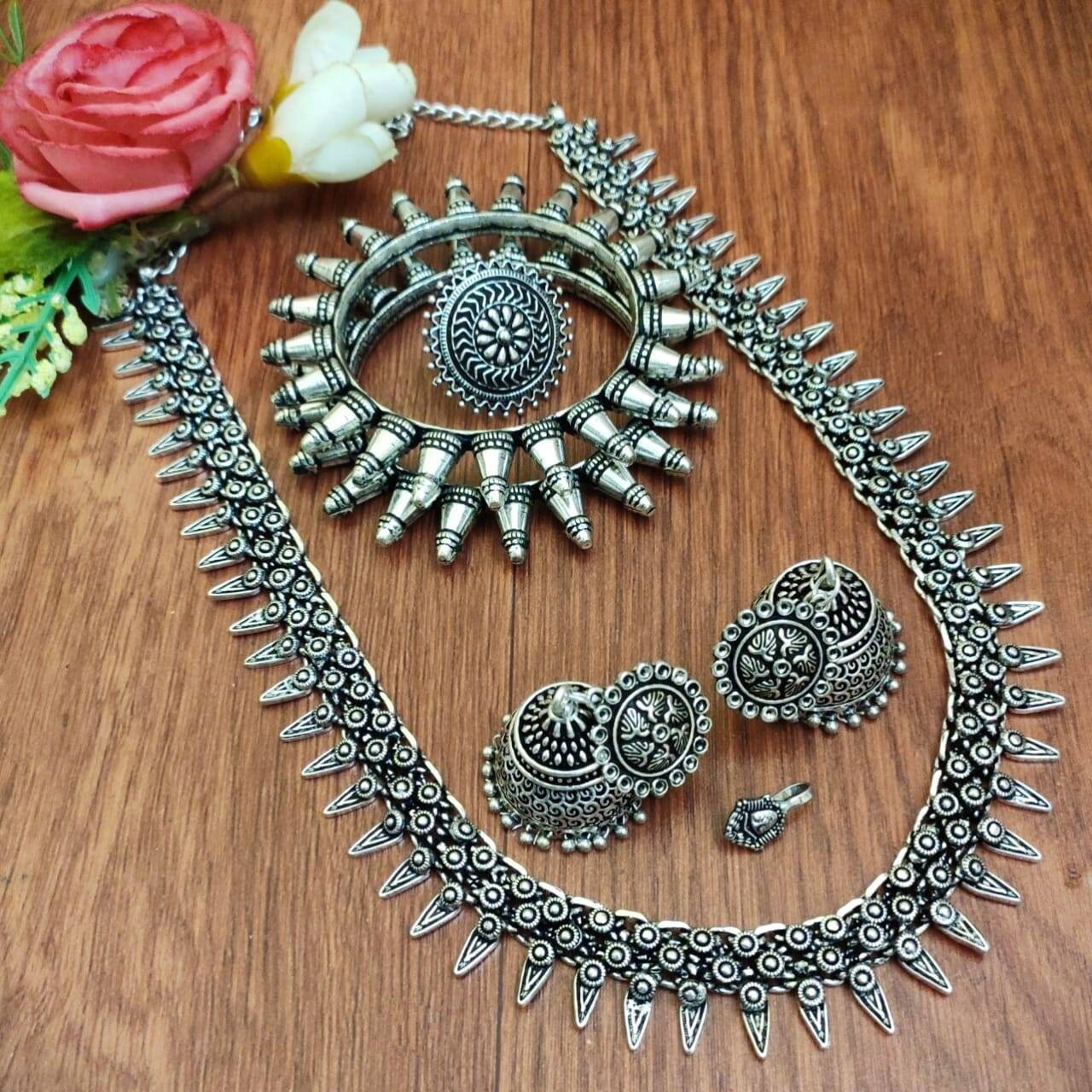 Adorn your beautiful personality with this exquisitely designed and handcrafted necklace in high quality German Silver. Pair it up with any casual,semi formal or formal attire for that traditional yet contemporary look.Premium quality