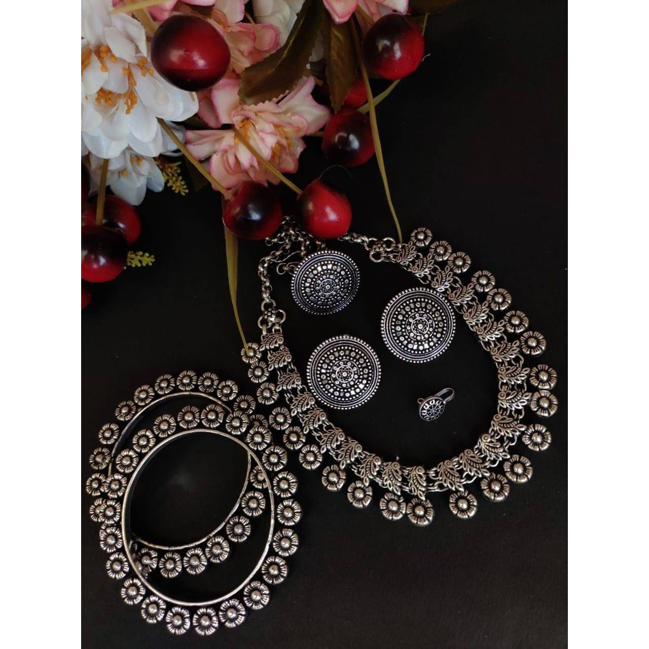 It is easy to see why oxidized jewelry has gained popularity. Not only does it have a unique look but it is versatile and cost-effective in comparison to purer metals like gold and silver. These pieces have an old-world charm and traditional appeal. These can be worn for a wedding, engagement, party, prom, and any special occasion. It will complement your special days like Valentine's Day, Birthdays, Anniversaries, and Mother's Day.  This set includes a long necklace, a pair of jhumki, nose pin,