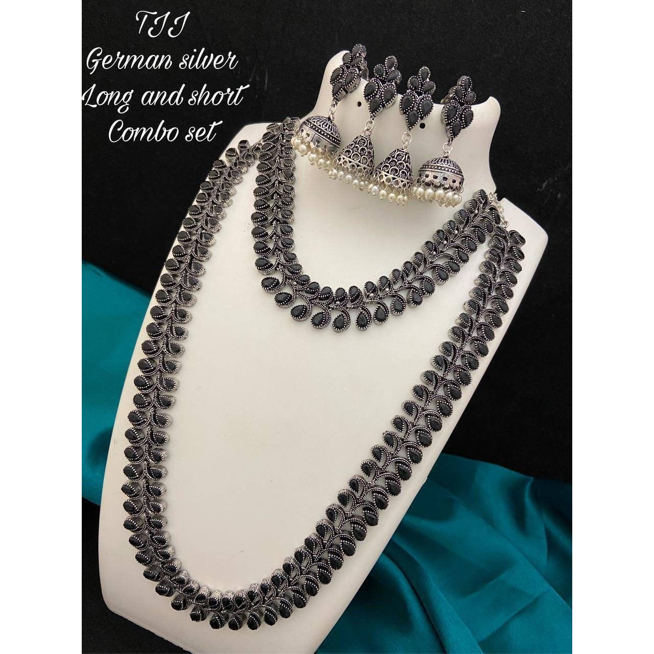 Are you looking to step up your ethnic look by a notch This oxidized silver jewelry is the perfect product for you. This set consists of an oxidized choker and a pair of jhumkas. The beautifully designed traditional jhumkas, paired with a touch of contemporary style on the choker, make this the bestseller combo. This set is a perfect fit forwedding jewelryand party wear. You can flaunt this set with an elegant saree or a gorgeous lehenga to make the jewelry shine. TheKundan earrings