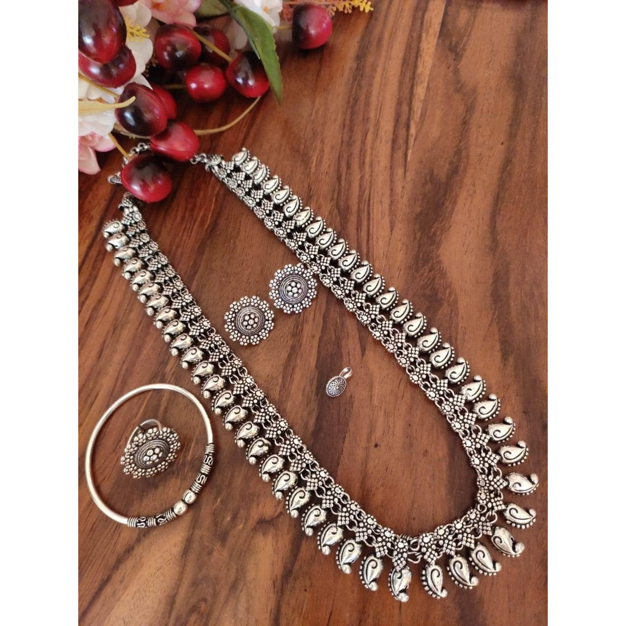 Step out in style with this beautiful oxidised silver plated earrings, which have been given a drop designer dangler perfectly designed. It will add bling to your look. This earring will go well with any of your ethnic outfits.