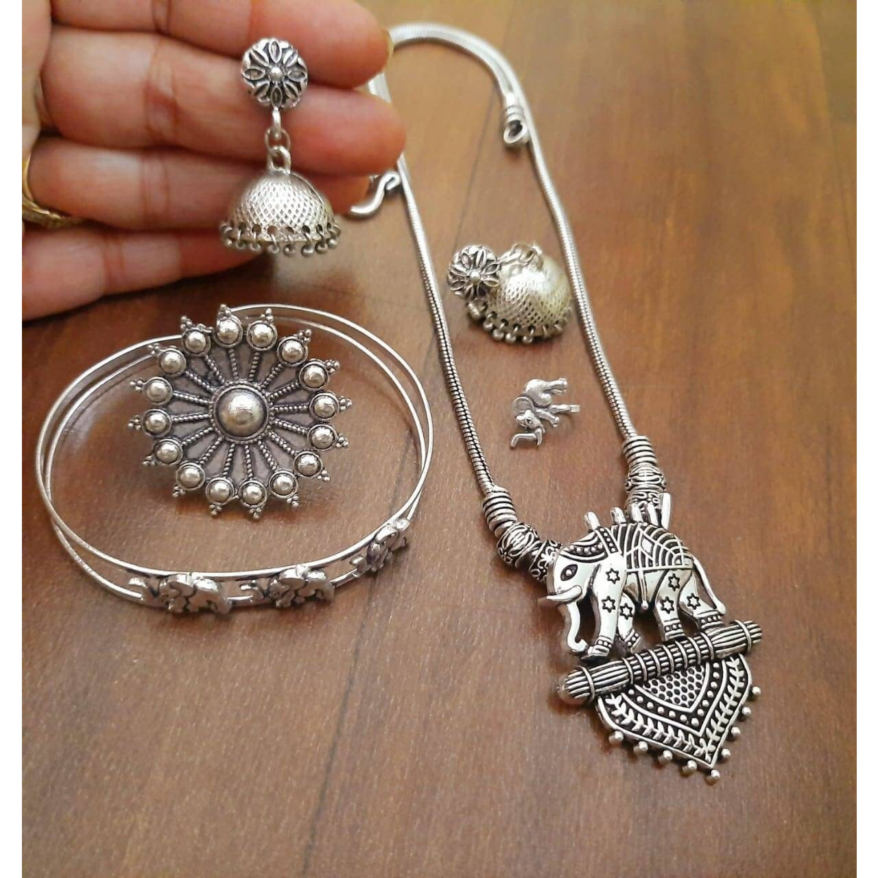 This Exotic Oxidised Chandelier Earring For Women is made of Alloy. Women love jewellery specially traditional jewellery adore a women. They wear it on different occasion. They have special importance on ring ceremony, wedding and festive time. They can also wear it on regular basics. Make your moment memorable with this range. This jewel set features a unique one of a kind traditional embellish with antic finish.This Exotic Oxidised Chandelier Earring For Women is made of Alloy. Women love jew