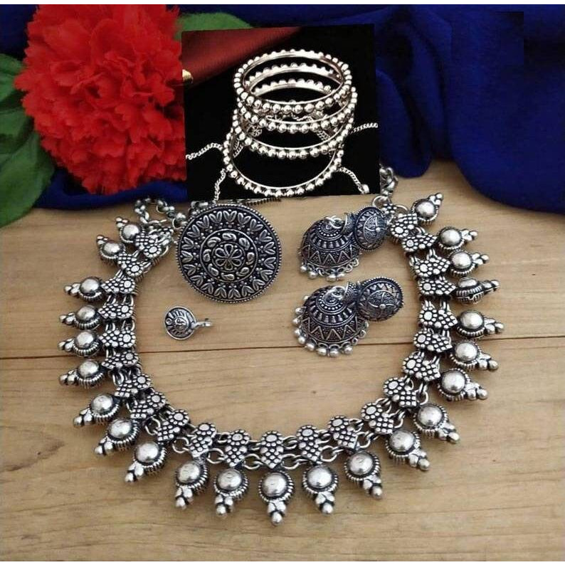 This beautiful oxidized Haath Phool is a part of Indian bridal jewelry. This Indian ethnic Haath Phool comes with an attached adjustable RingIt is easy to see why oxidized jewelry has gained popularity. Not only does it have a unique look but it is versatile and cost effective in comparison to purer metals like gold and silver. Oxidized metal comes in myriad patterns with stone work, delicate carving and enamelling to name a few. These pieces have an old world charm and traditional appealAmazing