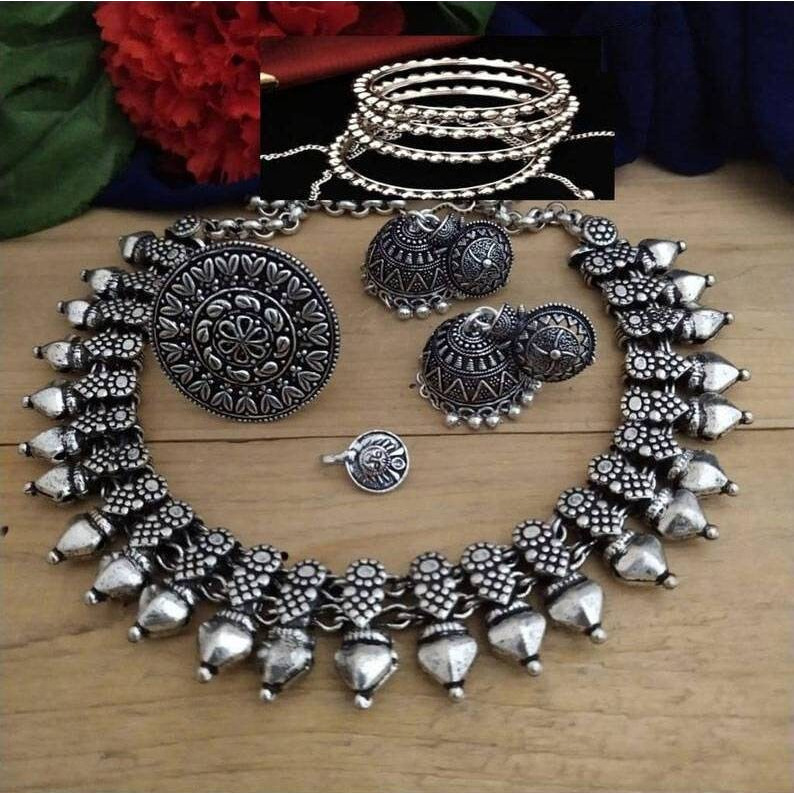 This beautiful oxidized Haath Phool is a part of Indian bridal jewelry. This Indian ethnic Haath Phool comes with an attached adjustable RingIt is easy to see why oxidized jewelry has gained popularity. Not only does it have a unique look but it is versatile and cost effective in comparison to purer metals like gold and silver. Oxidized metal comes in myriad patterns with stone work, delicate carving and enamelling to name a few. These pieces have an old world charm and traditional appealAmazing